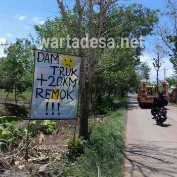 peringatan dam truk